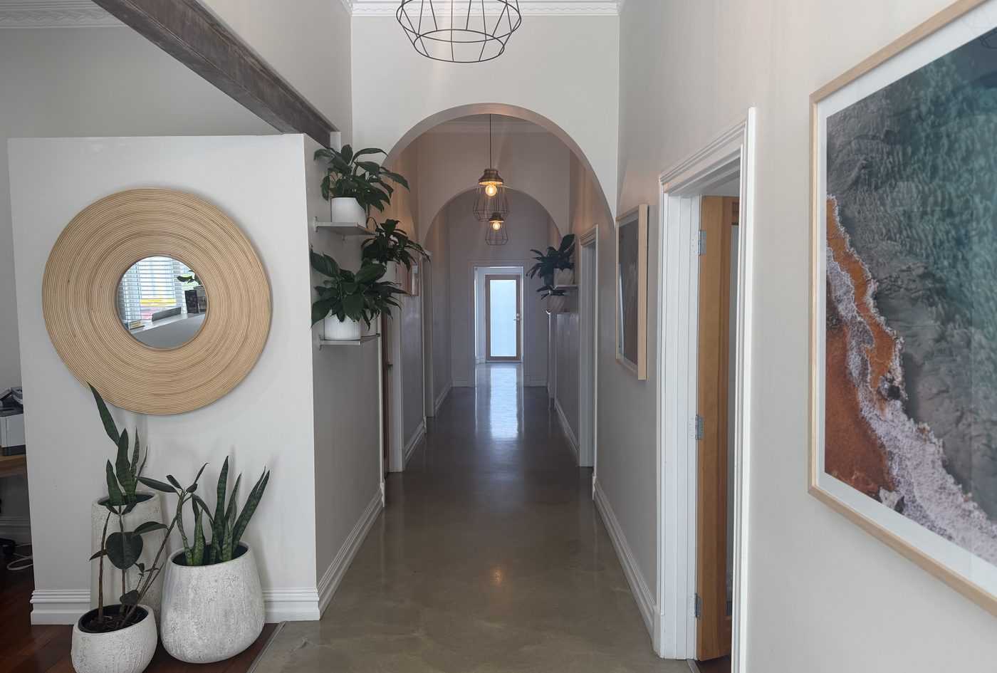 Hallway inside the Pain Medicine WA consulting rooms, with level flooring and wide doorways